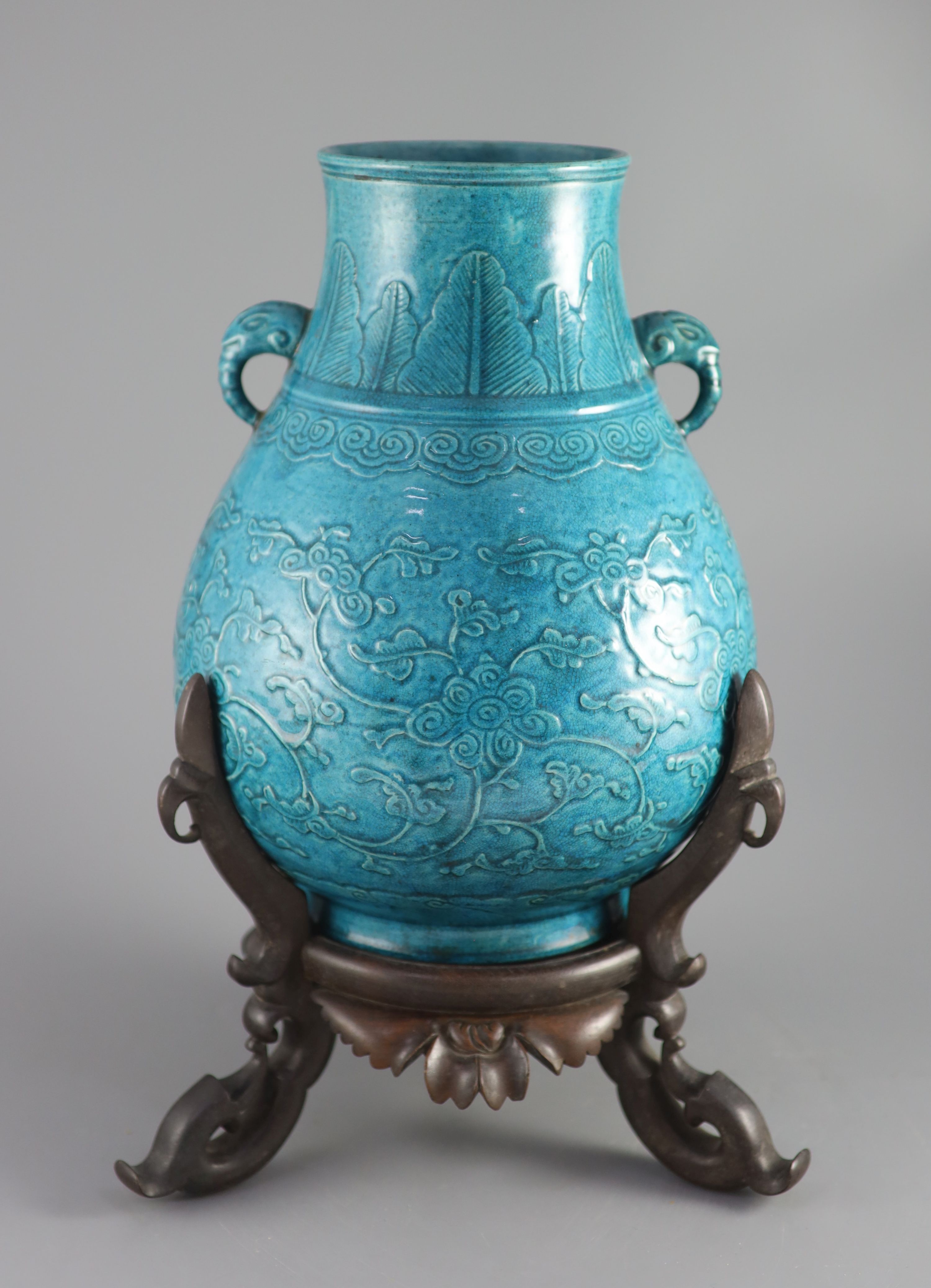 A Chinese turquoise glazed vase, Hu, late Qing dynasty, 31cm high. overall height 41cm.